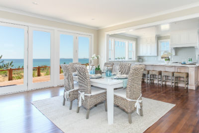 Photograph of Dining room with ocean in the background