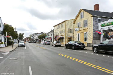 Photograph of a town in Plymouth that has many shops and restaurants