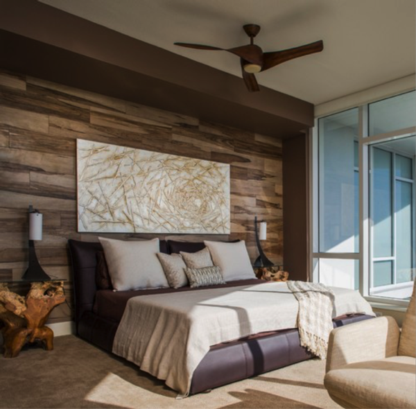 photograph of a high in the sky contemporary bedroom with a king sized bed