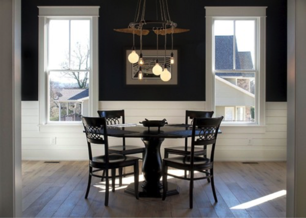photograph of fairhills home farmhouse dining room with a dining room table, chairs and chandellier