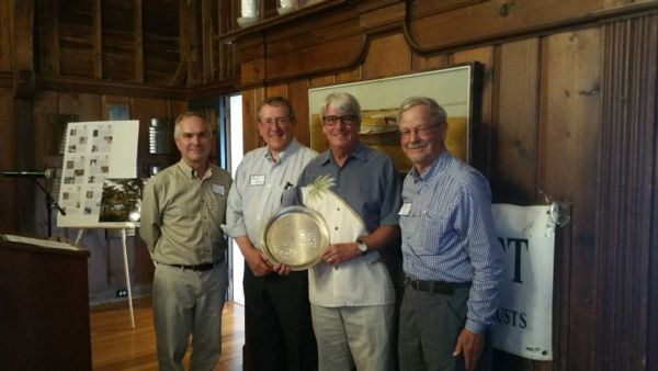 Photograph of David Doherty and associates holding the ansel chaplin award