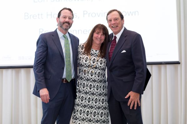 Photograph of (From left to right): Mike Schlott, President, Kinlin Grover Real Estate; Sandra Tanco, Kinlin Grover’s top-producing sales agent in 2018; Doug Randall, CEO, Kinlin Grover Real Estate.