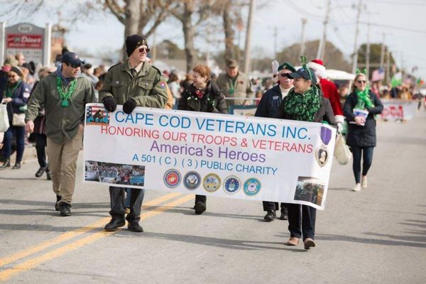 Photograph of veterans holding a sign in the saint patricks day parade