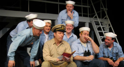 Photograph of Actors dressed as sailors performing in a play